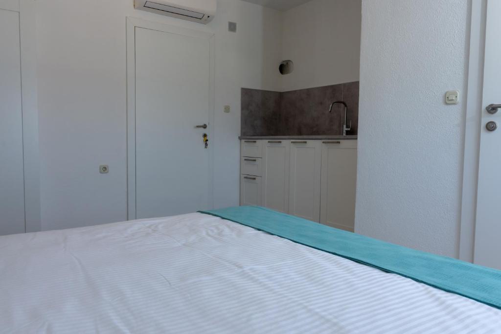 Posteľ alebo postele v izbe v ubytovaní The View Split. Highlight with Roof-Top-Terrace and Pool