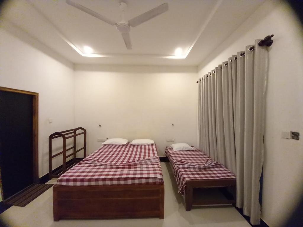 Postel nebo postele na pokoji v ubytování Hotel krish