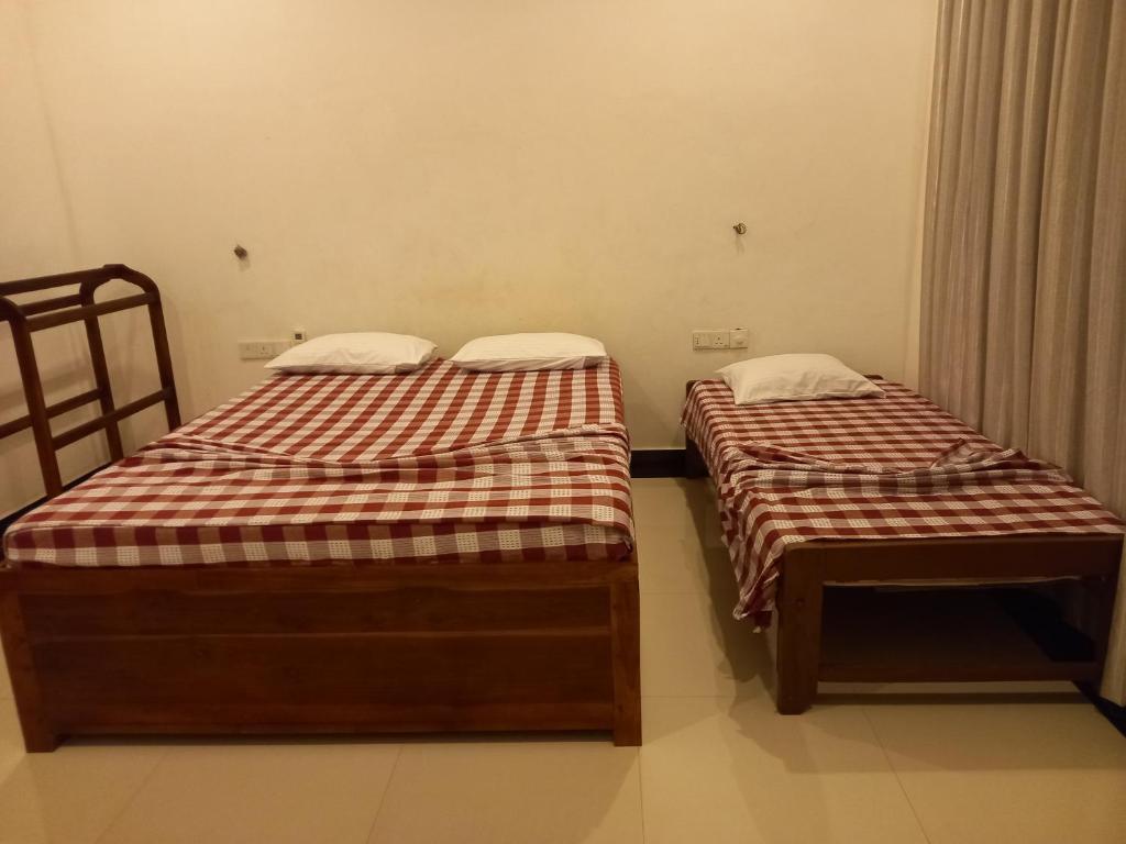 Postel nebo postele na pokoji v ubytování Hotel krish