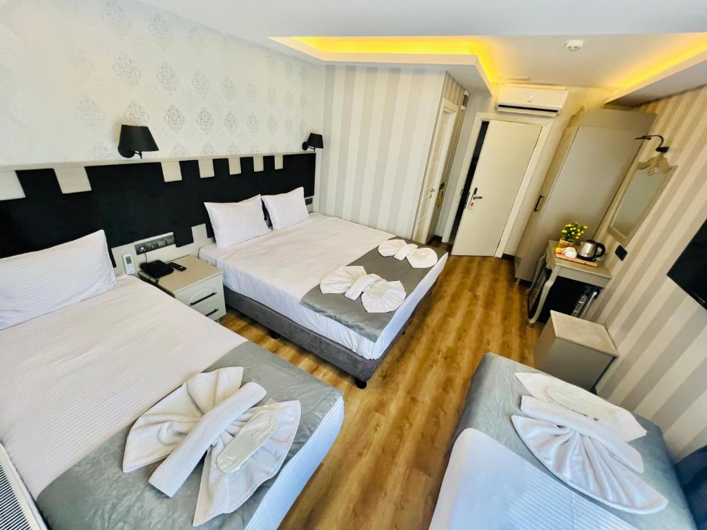 Postel nebo postele na pokoji v ubytování Old City Viva Hotel