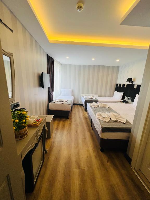 Postel nebo postele na pokoji v ubytování Old City Viva Hotel