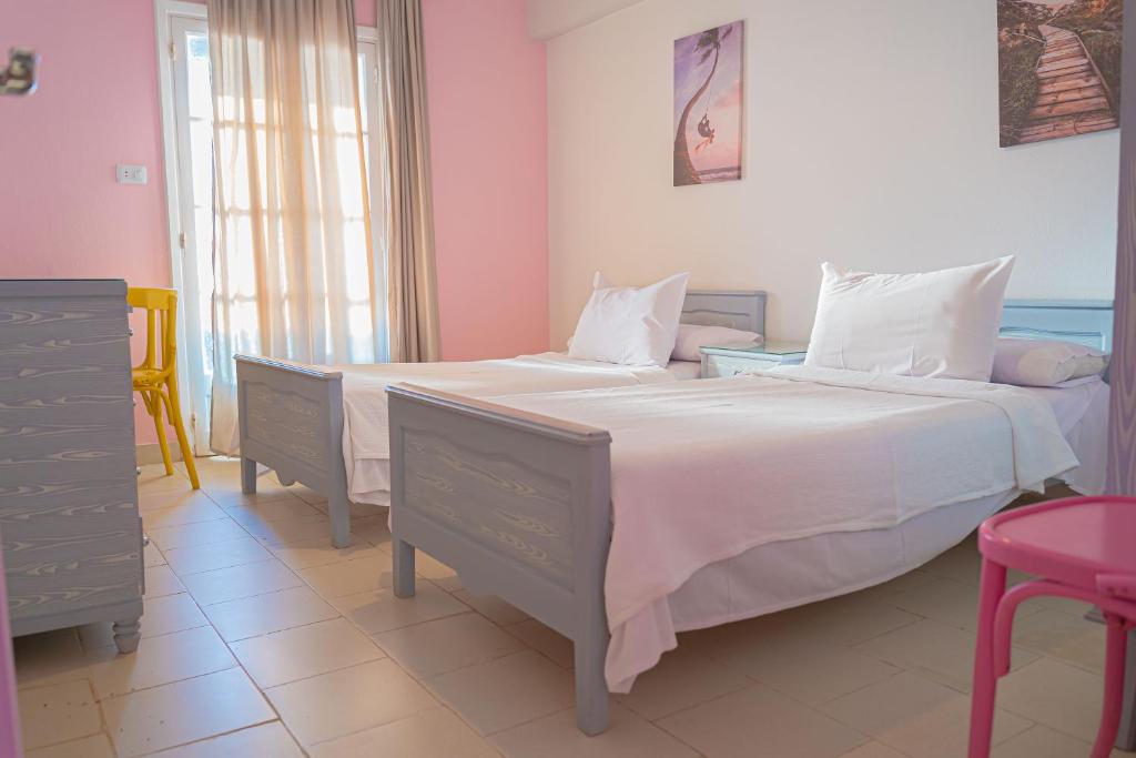 Postel nebo postele na pokoji v ubytování فندق الشاطئ رأس البر-Beach Hotel Ras Elbar