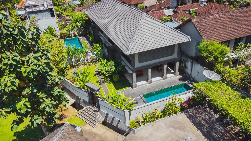 an aerial view of a house with a swimming pool at Full Moon Villa Ubud in Ubud