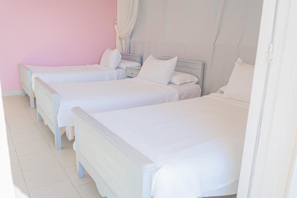 Postel nebo postele na pokoji v ubytování فندق الشاطئ رأس البر-Beach Hotel Ras Elbar