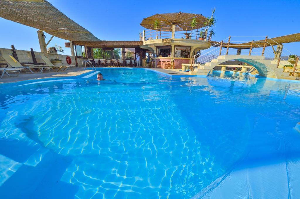 a large swimming pool in a resort at Anemomili Village in Kissamos