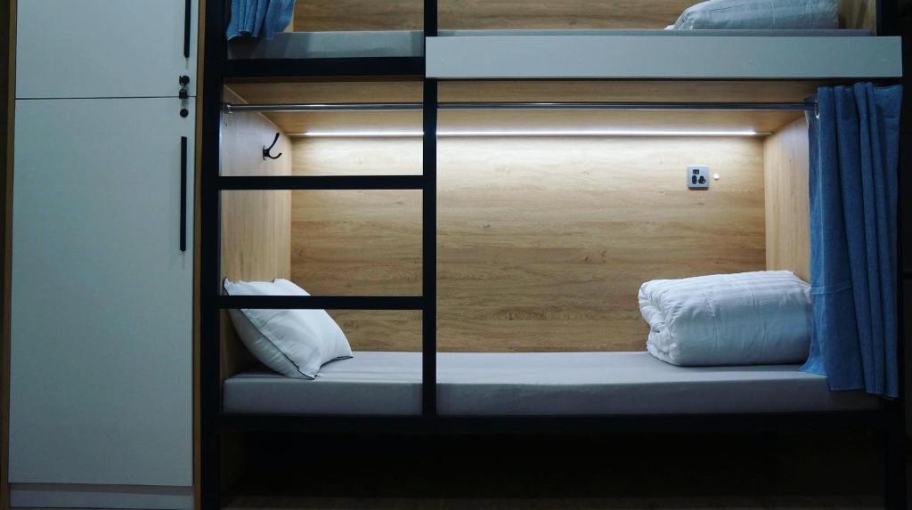 Posteľ alebo postele v izbe v ubytovaní HostelOne