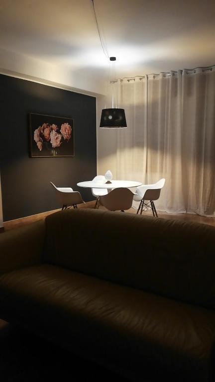 a living room with a couch and a table at Casa del Sole in Mondragone