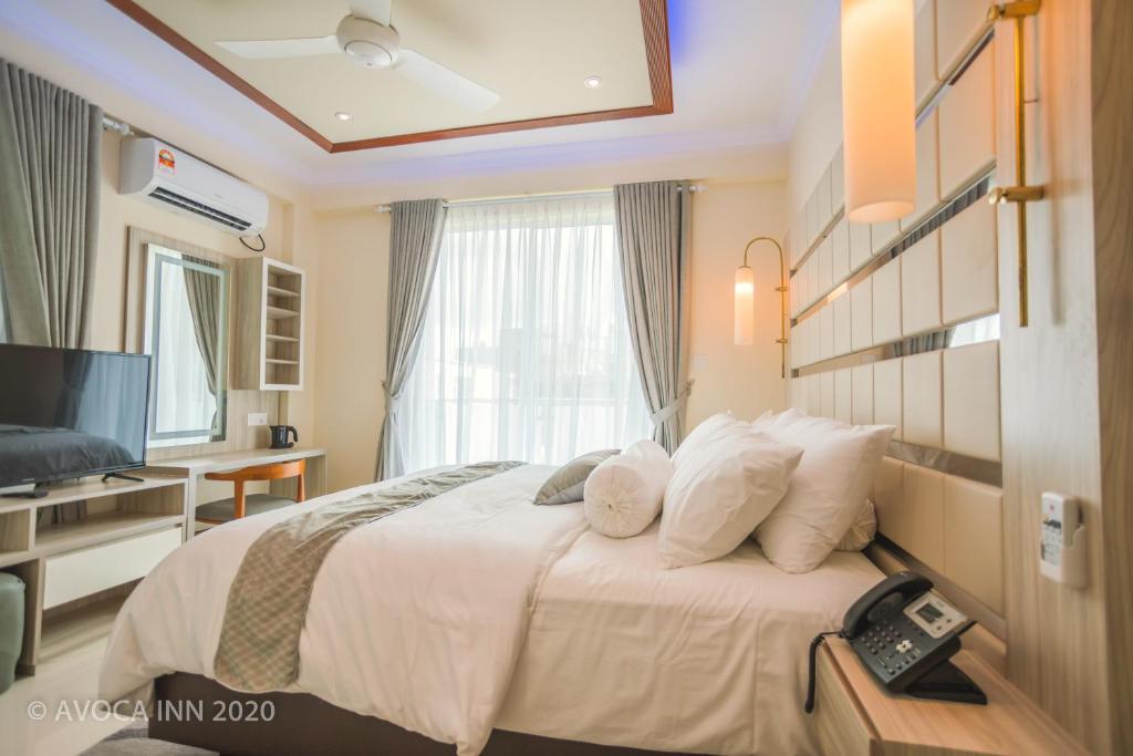 Postel nebo postele na pokoji v ubytování Avoca Inn