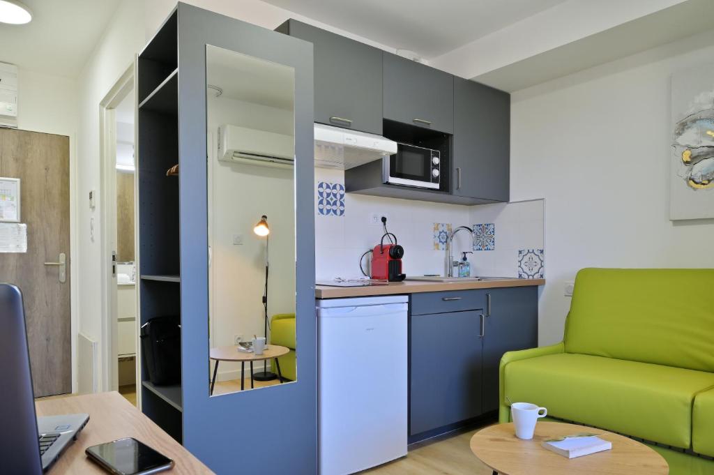 Kuchnia lub aneks kuchenny w obiekcie Résidence Easy Lodge