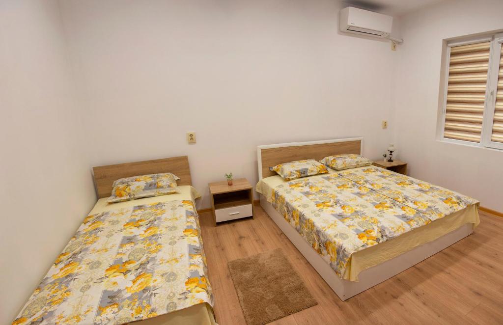 Кровать или кровати в номере Панорама