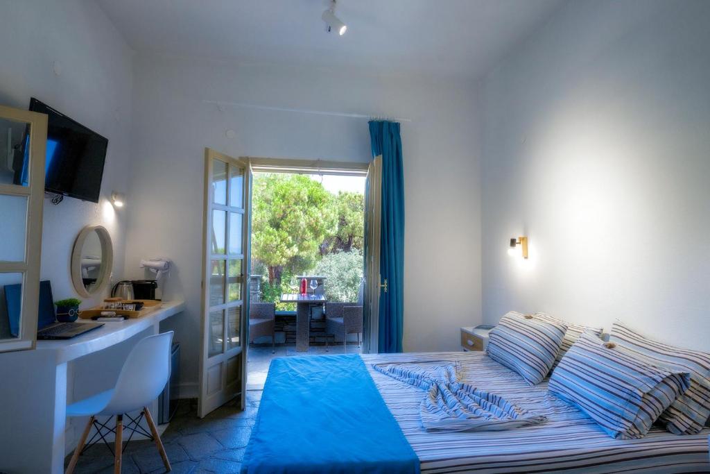 Postel nebo postele na pokoji v ubytování PETRA MARE SUITES