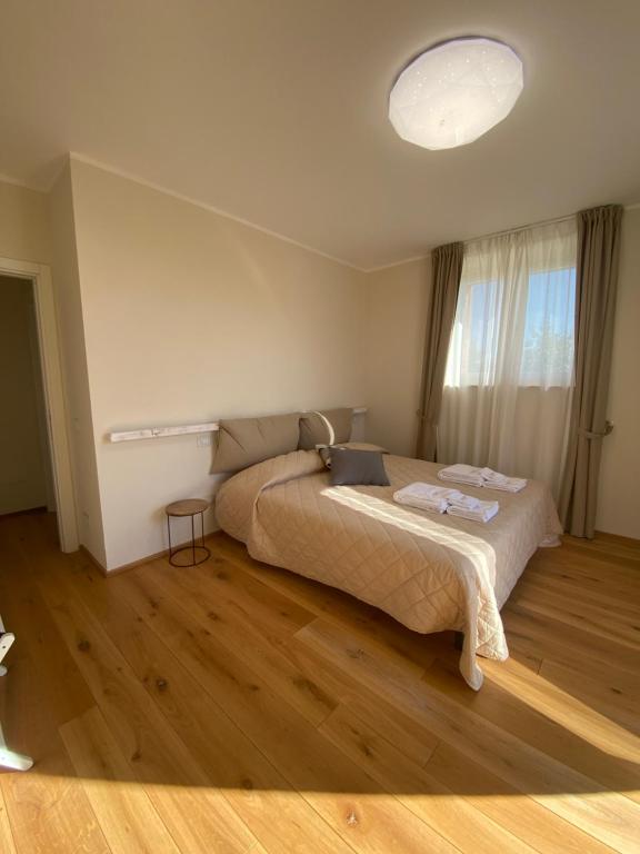 Postel nebo postele na pokoji v ubytování Podere Belsogno-Camera Lavanda