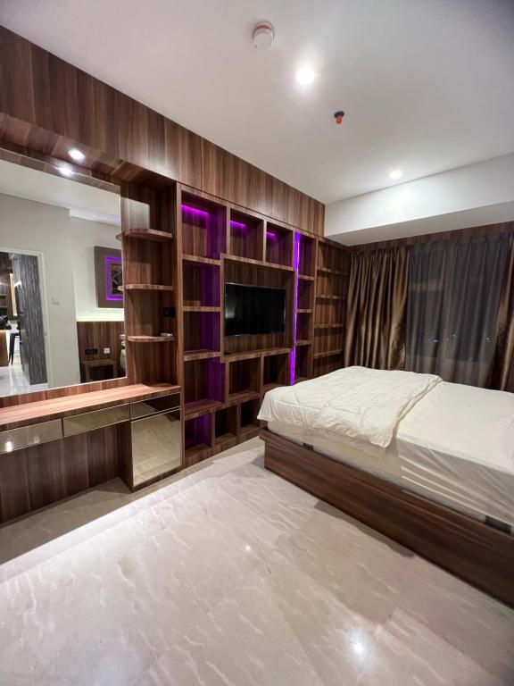 Katil atau katil-katil dalam bilik di Apartment podomoro deli city lexington tower