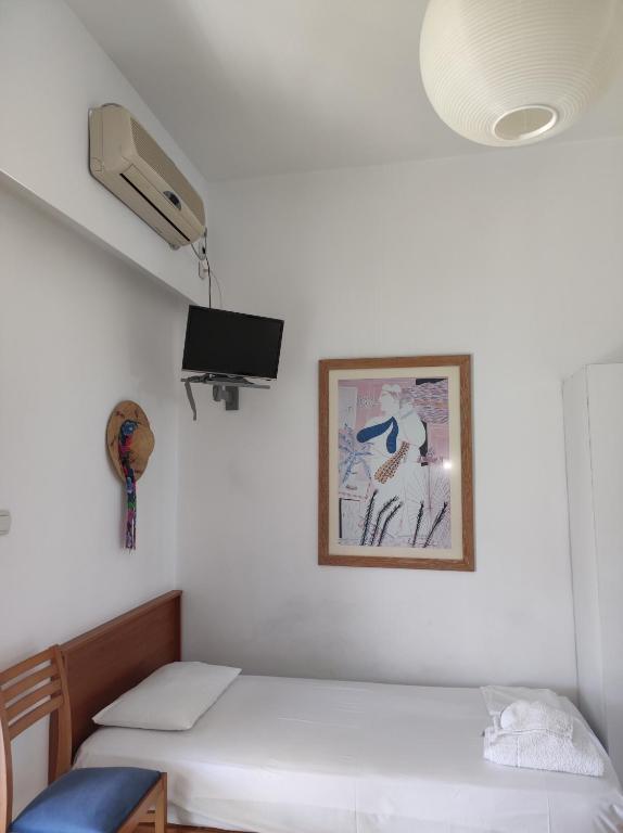 Postel nebo postele na pokoji v ubytování Hotel Ritsa