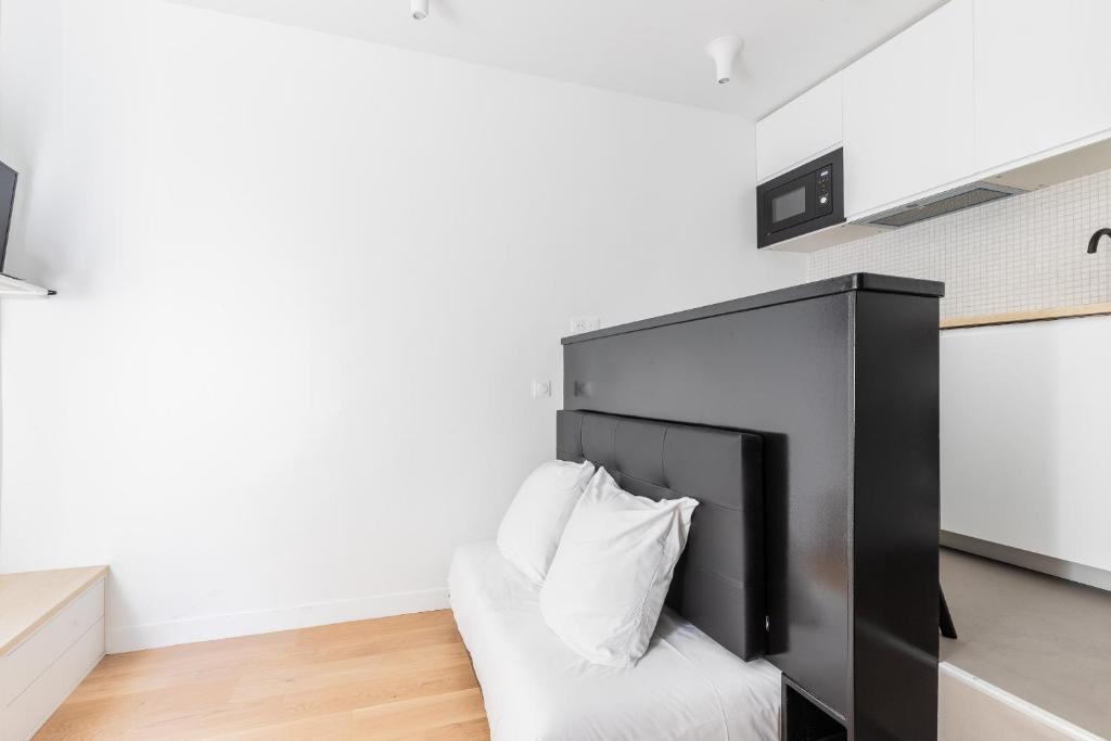 Televízia a/alebo spoločenská miestnosť v ubytovaní Studio 2Pers#Les Halles#Etienne Marcel#AC