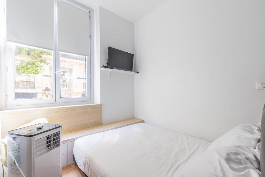 Posteľ alebo postele v izbe v ubytovaní Studio 2Pers#Les Halles#Etienne Marcel#AC