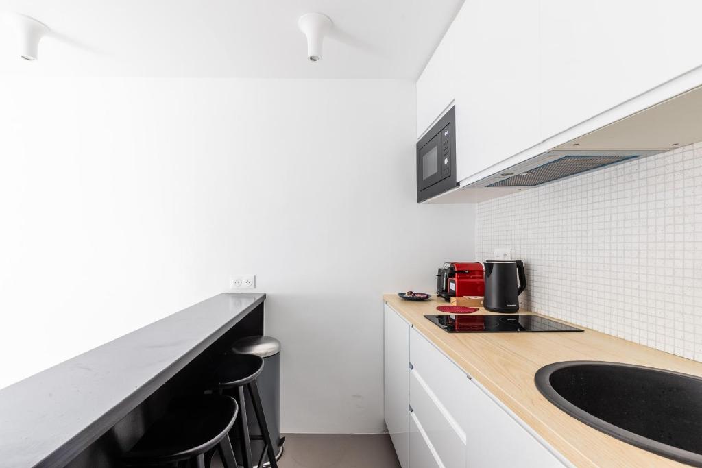 Kuchyňa alebo kuchynka v ubytovaní Studio 2Pers#Les Halles#Etienne Marcel#AC
