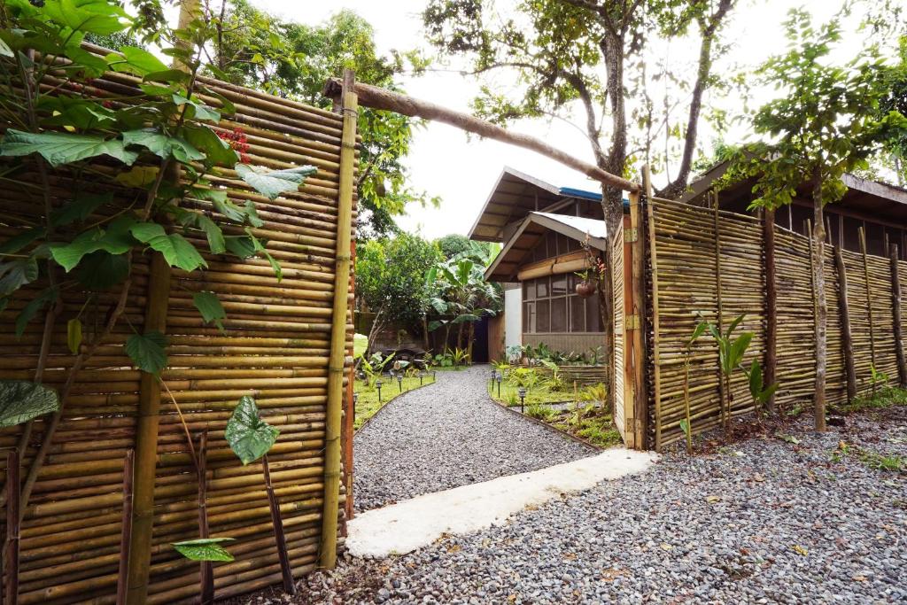 a wooden fence in front of a house at Fisheye Villa in El Nido