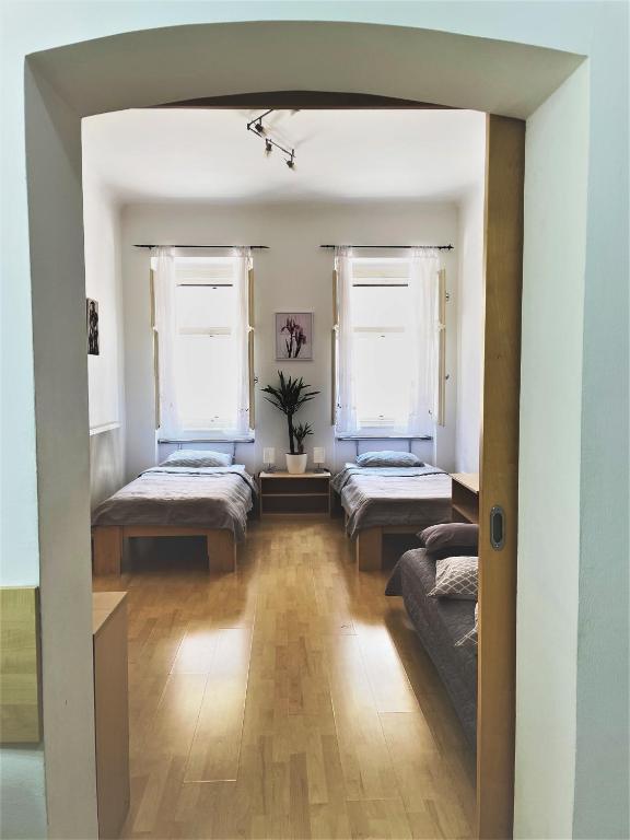 Postel nebo postele na pokoji v ubytování Viktorija City Center Apartment