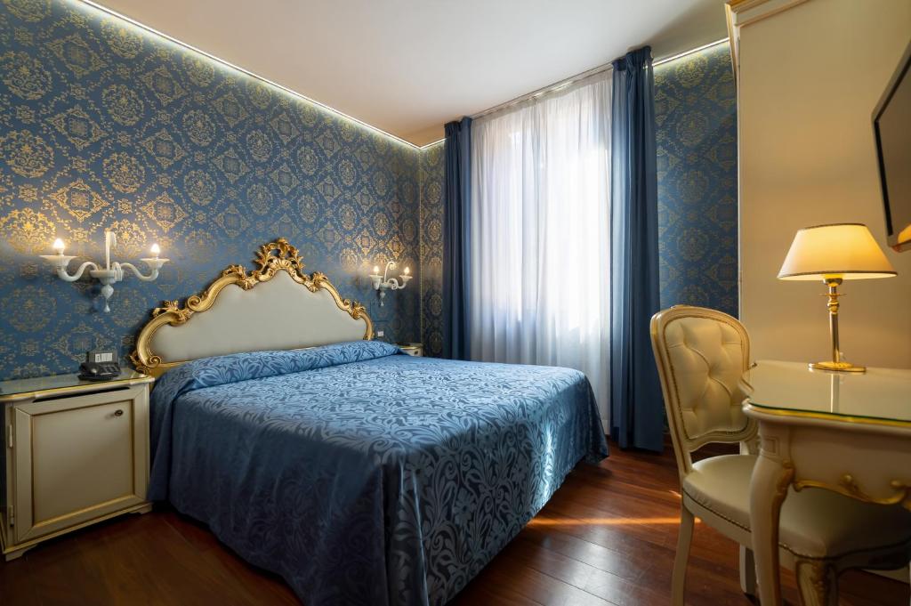 Postel nebo postele na pokoji v ubytování Hotel Santa Marina