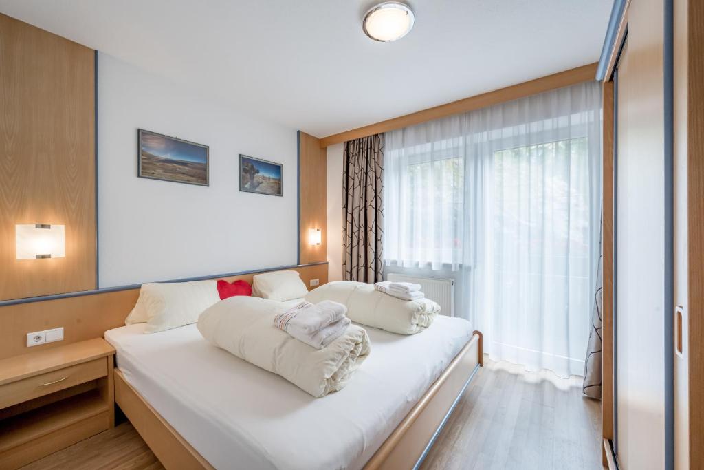 Posteľ alebo postele v izbe v ubytovaní Apart Holiday