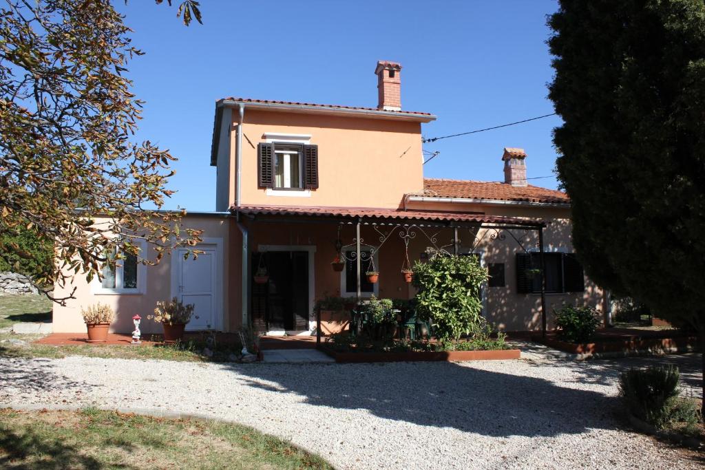 a house with a driveway in front of it at Holiday house with a parking space Presika, Labin - 7391 in Labin