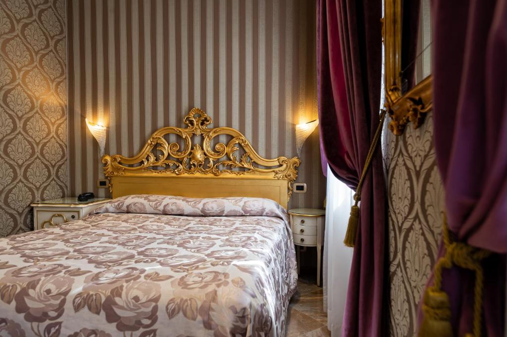 Postel nebo postele na pokoji v ubytování Hotel Santa Marina