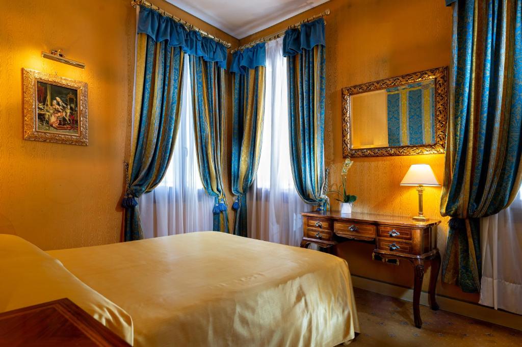 Postel nebo postele na pokoji v ubytování Hotel Santa Marina