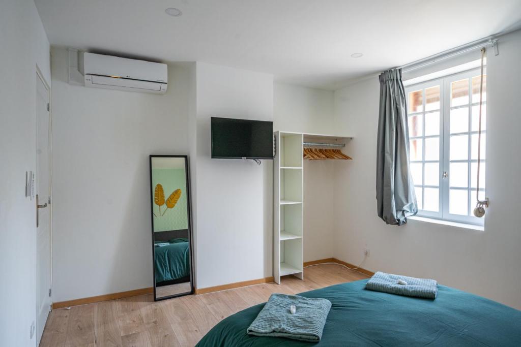 Posteľ alebo postele v izbe v ubytovaní Capstay la Rhonelle - Netflix - 2 chambres - Cuisine
