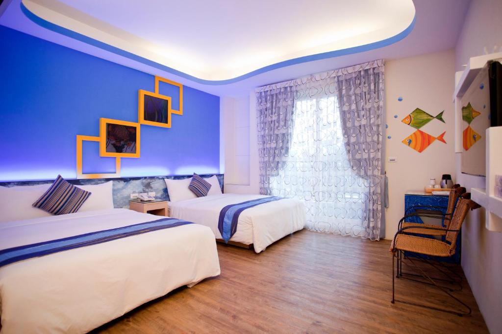 Postel nebo postele na pokoji v ubytování Millennium Inn