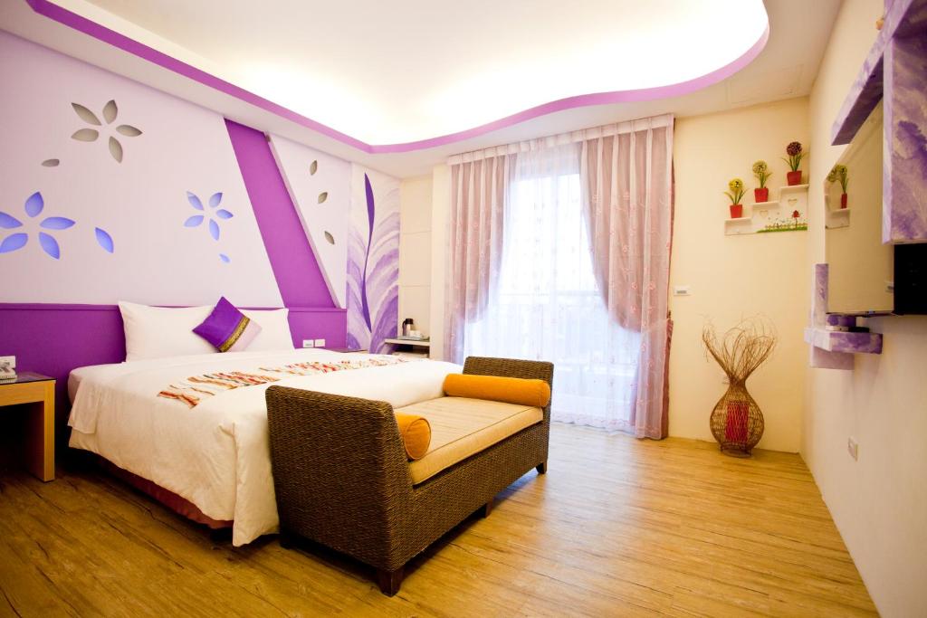 Postel nebo postele na pokoji v ubytování Millennium Inn