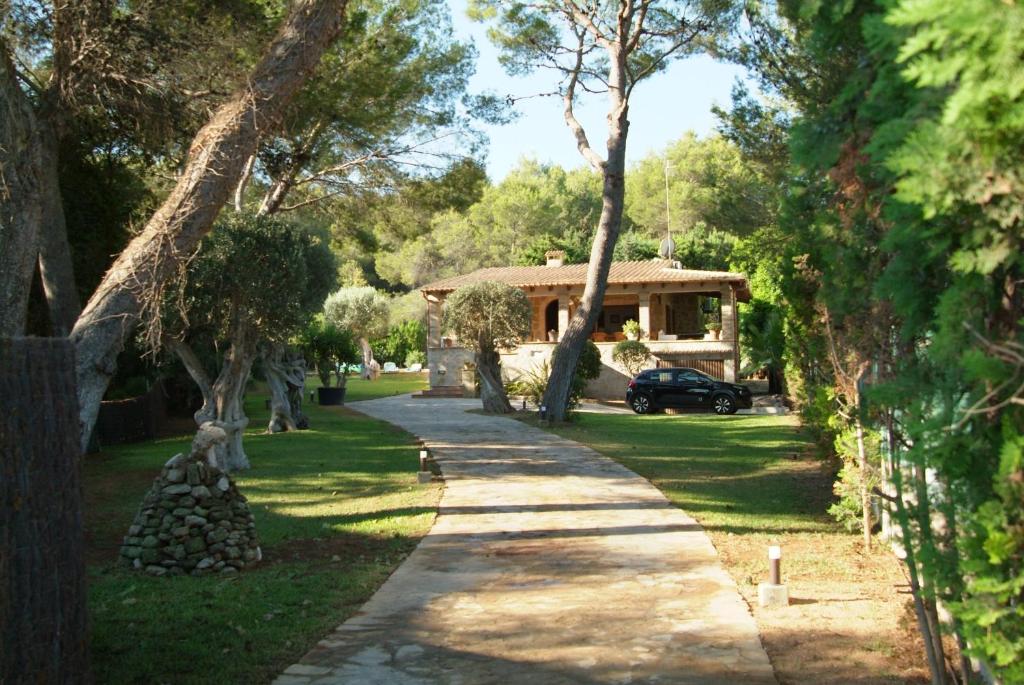 A garden outside Nostra Caseta villa with pool & marina view near beaches