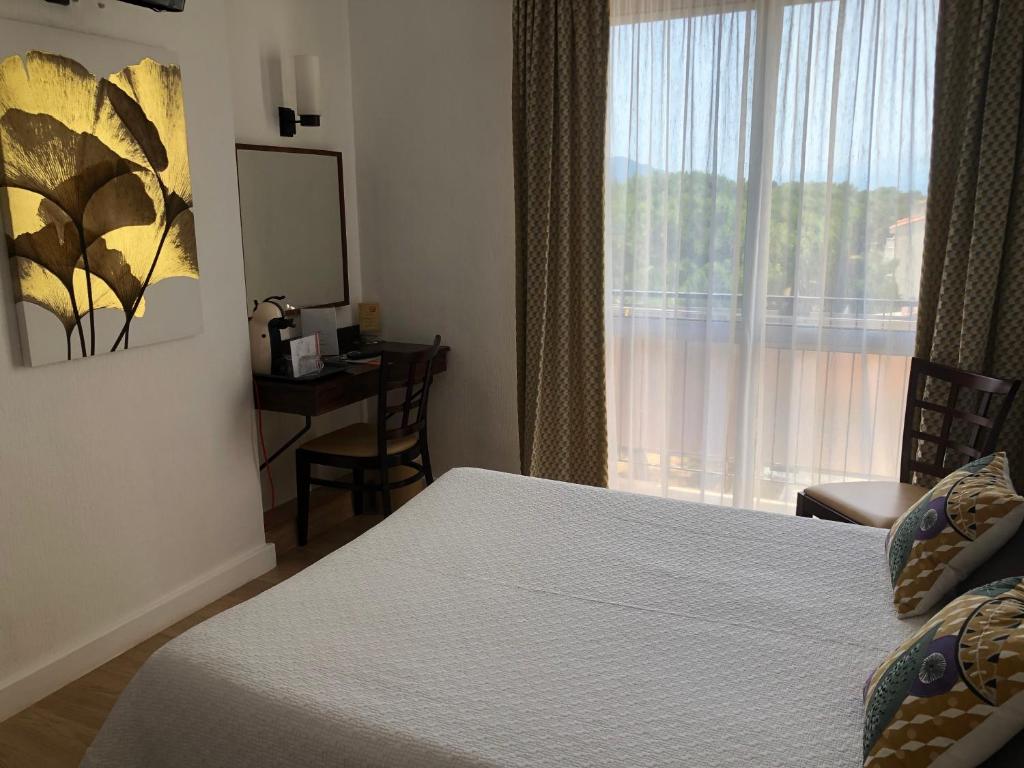 Postel nebo postele na pokoji v ubytování Plage des Pins