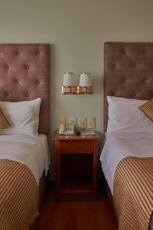 Postel nebo postele na pokoji v ubytování Casona Plaza Hotel Arequipa