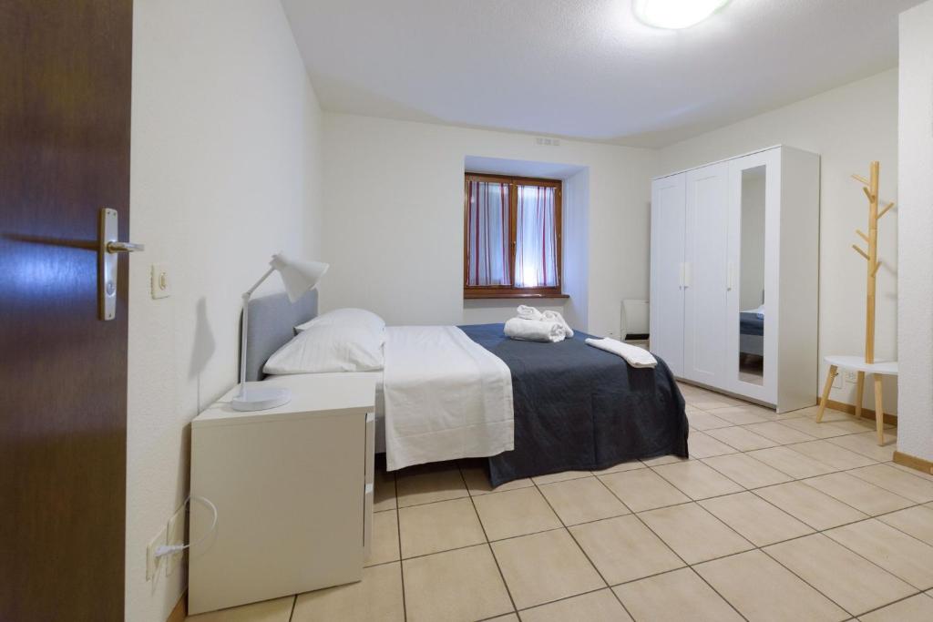 Una cama o camas en una habitación de Osteria Pozzo