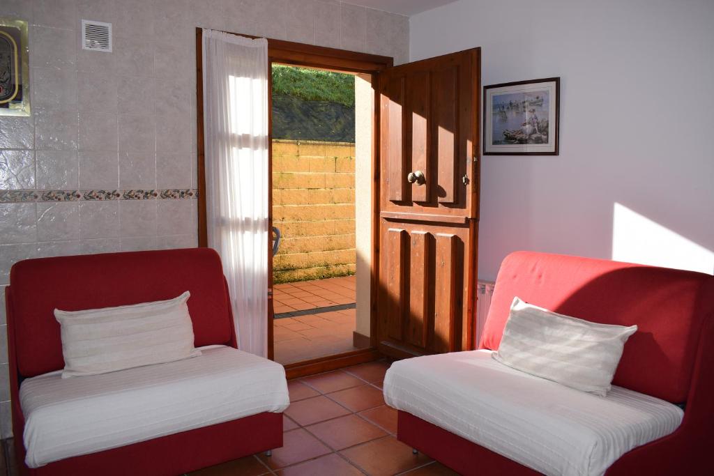 Posteľ alebo postele v izbe v ubytovaní Apartamentos Rurales la Taberna