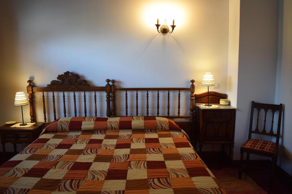Posteľ alebo postele v izbe v ubytovaní Apartamentos Rurales la Taberna