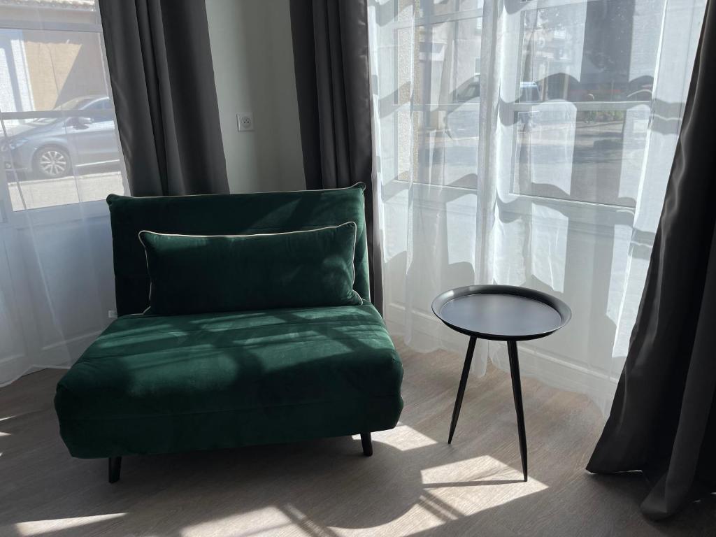 Posezení v ubytování Hôtel de la Glane