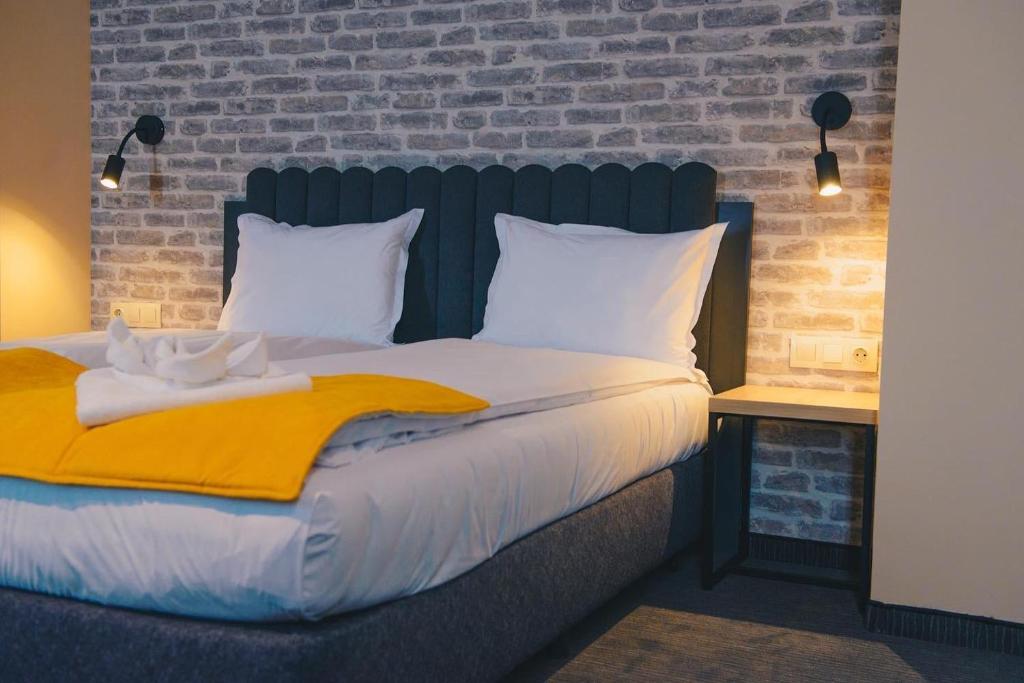 Postel nebo postele na pokoji v ubytování ADEO HOTEL Sport & SPA