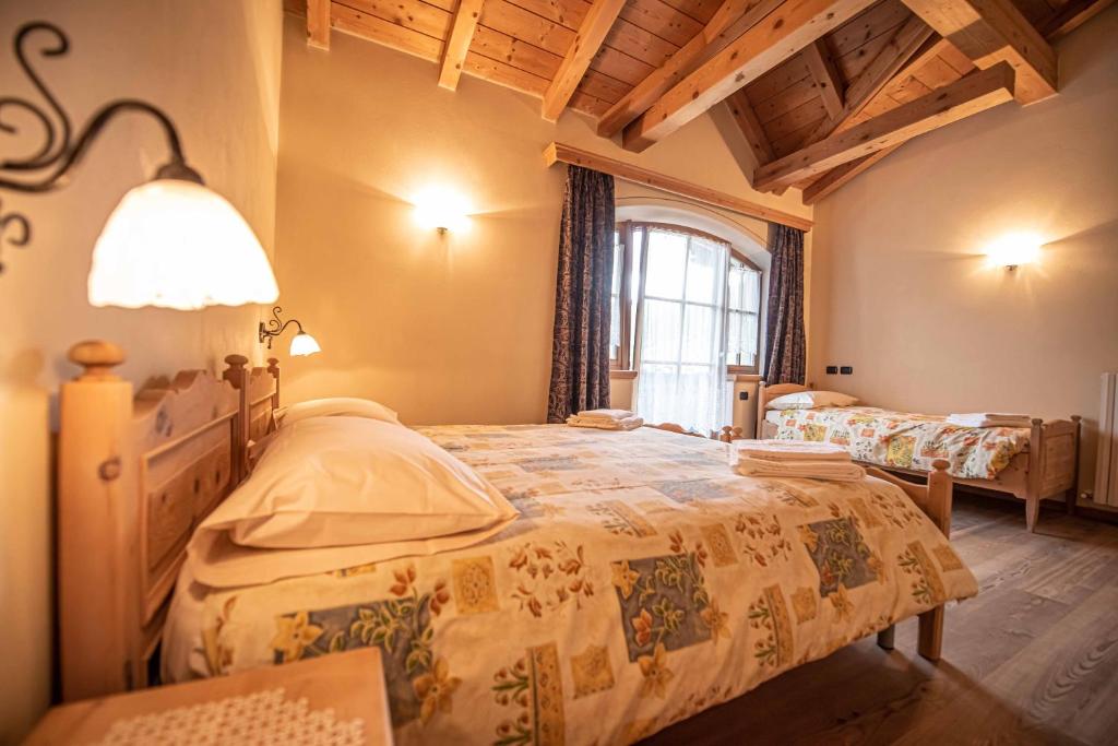 Posteľ alebo postele v izbe v ubytovaní Family House Amalia Myholidaylivigno