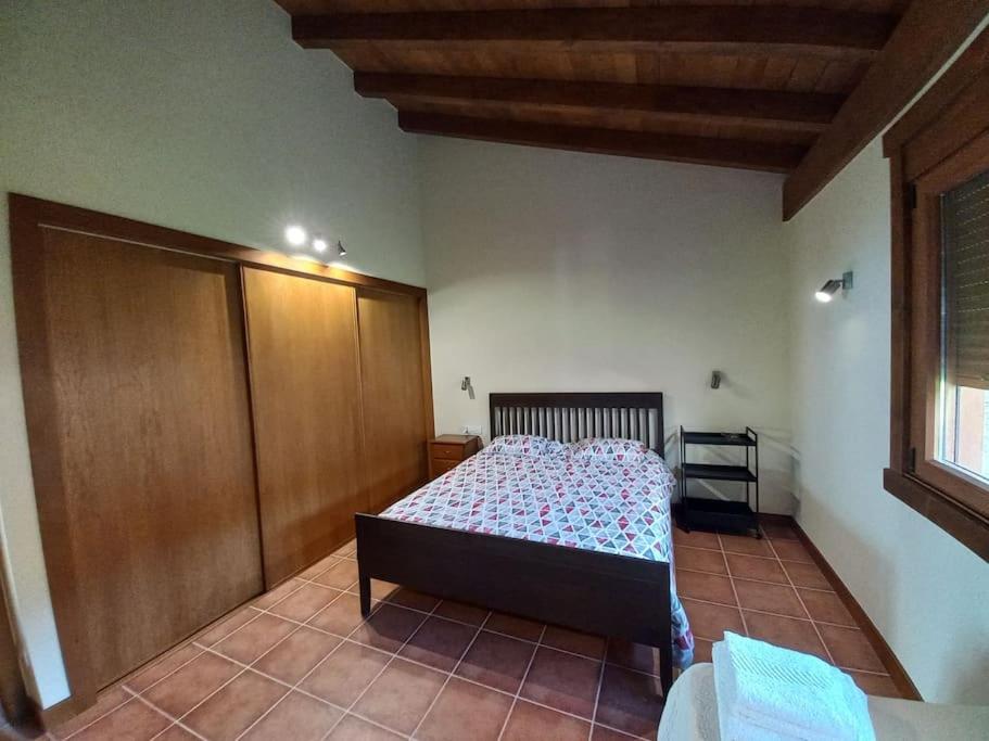 Łóżko lub łóżka w pokoju w obiekcie Lobetios - Casa rural