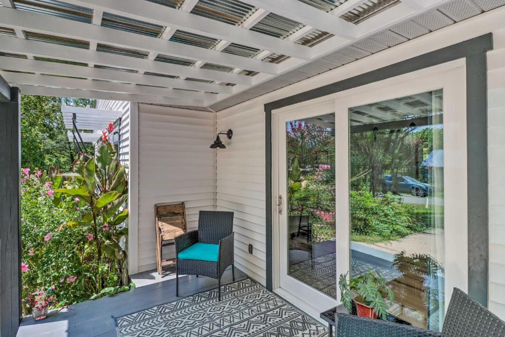 a screened porch with a chair on a house at Mountain View Home Steps to Amphitheater Park in Mountain View