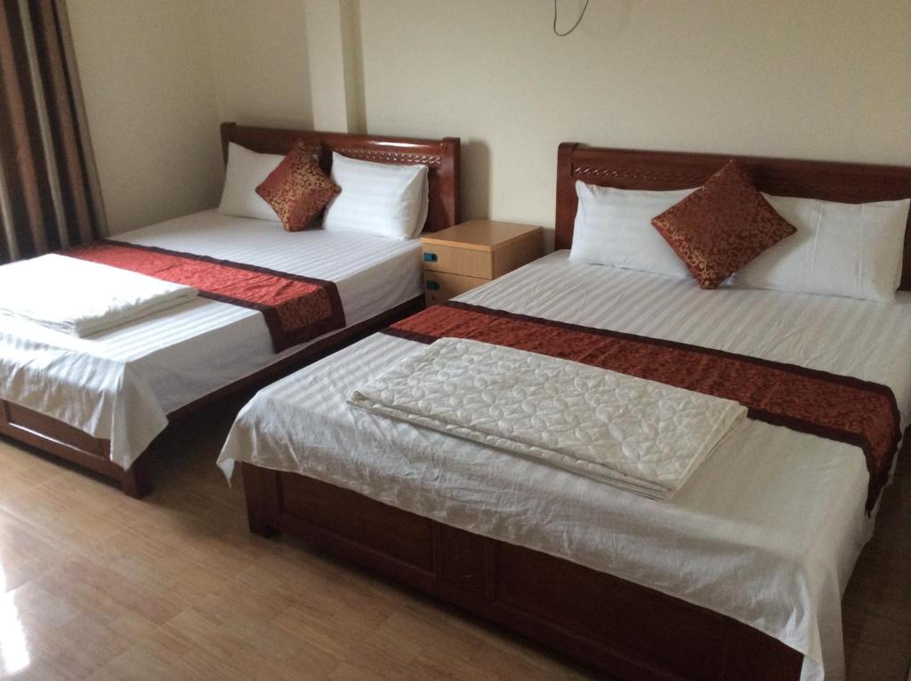 Postel nebo postele na pokoji v ubytování Anh Duong Hotel