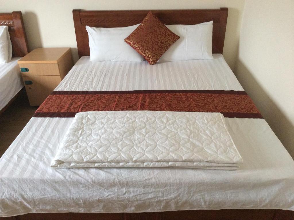 Postel nebo postele na pokoji v ubytování Anh Duong Hotel