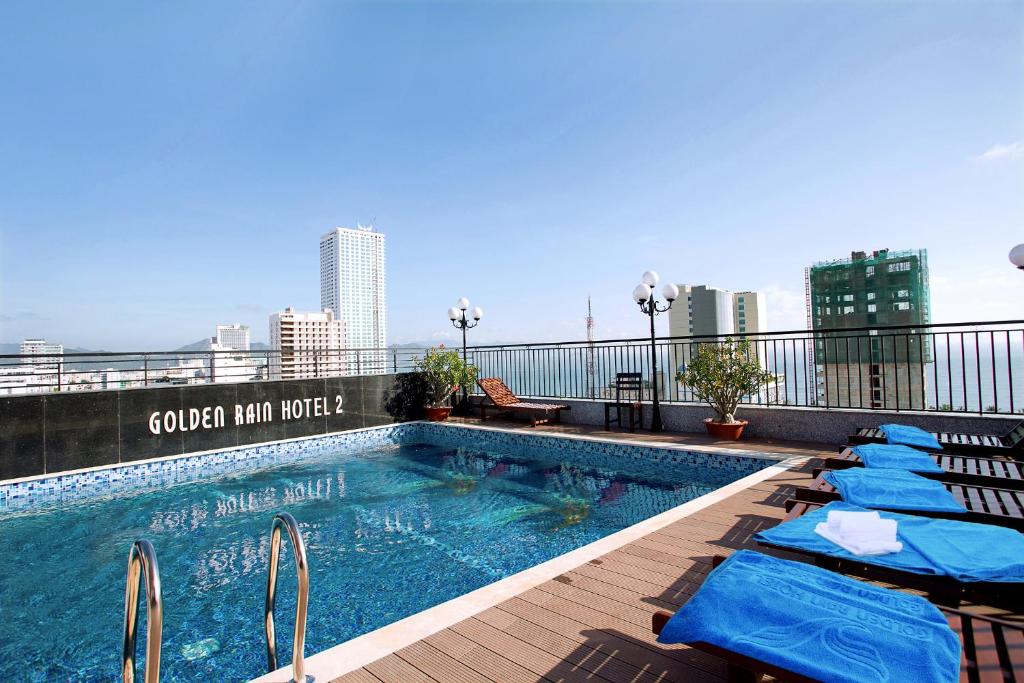 a swimming pool on the roof of a building at Golden Rain 2 Hotel in Nha Trang