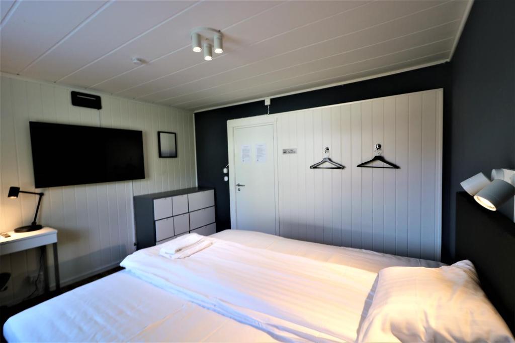 Postel nebo postele na pokoji v ubytování RIBO Apartment Arctic