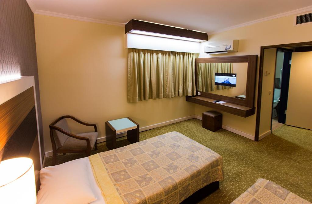 Postel nebo postele na pokoji v ubytování Derici Hotel