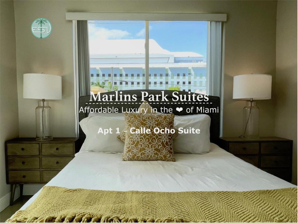 a bedroom with a bed with a large window at Marlins Park Suites - Apartment 1 - Calle Ocho Suite in Miami