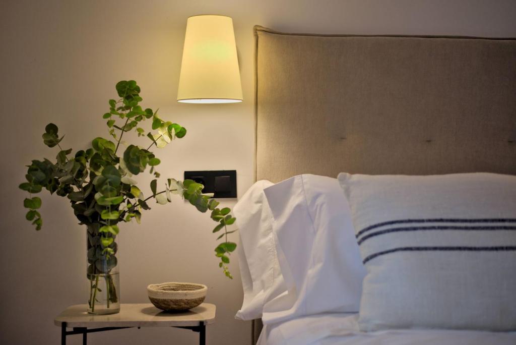 Postel nebo postele na pokoji v ubytování Hotel Casa Ernestina