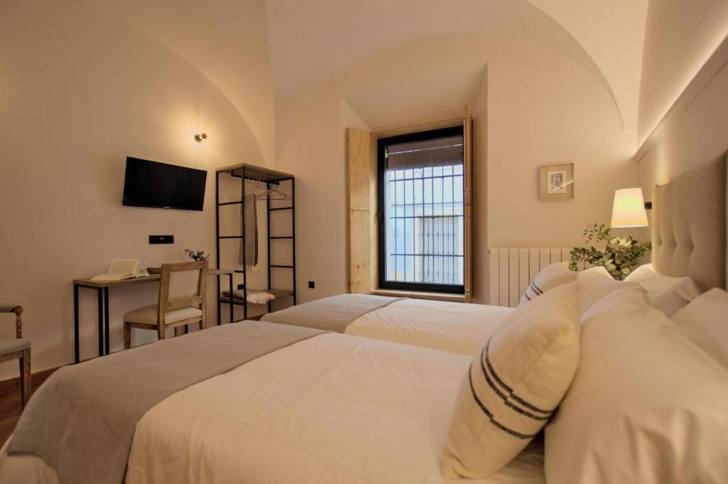 Postel nebo postele na pokoji v ubytování Hotel Casa Ernestina